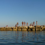 More visitors lining the pool