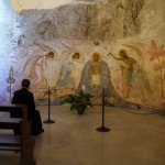 A priest communes with angels in the Monte S Angelo Grotto